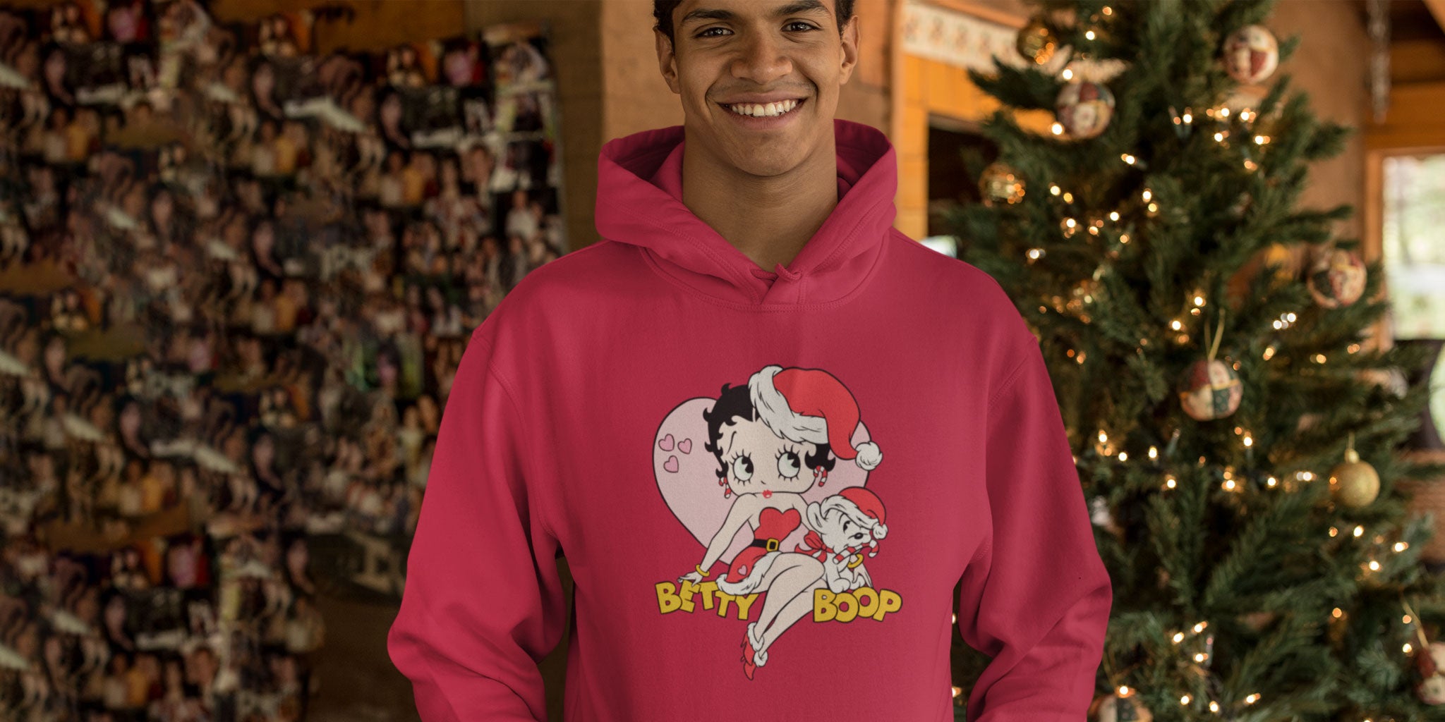 A young man wearing a 'Betty Boop Christmas And Pudgy Heart' hoodie